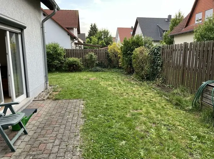 Before: yard with lawn before the remodel
